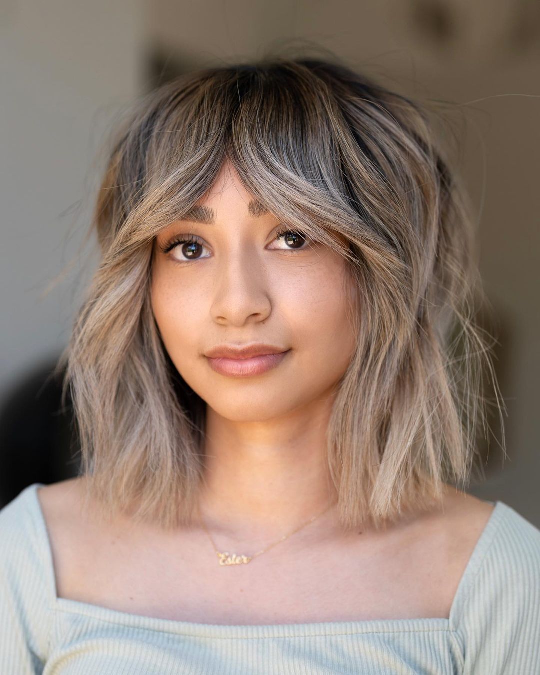 Collarbone Bob with Shaggy Ends and Curtain Bangs